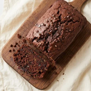 Delicious one-bowl chocolate zucchini bread topped with mini chocolate chips.