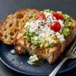 Delicious avocado toast topped with cottage cheese, perfect for a healthy meal.