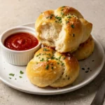 Delicious sourdough discard garlic knots topped with garlic butter