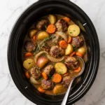 Crockpot meatballs with potatoes and carrots in a comforting meal
